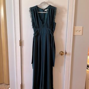 Teal sleeveless jumpsuit with pockets. Great for a wedding or formal event.
